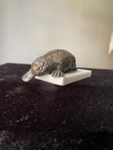 Small BRONZE Platypus on white marble